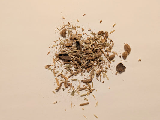 Pile of dried herbs on a beige background