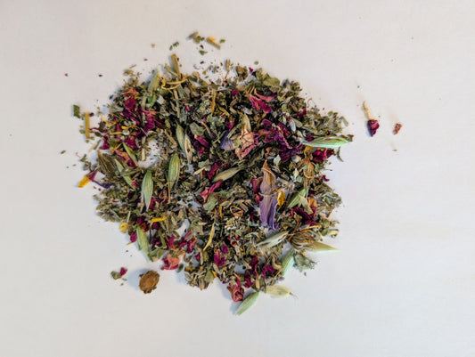Mixture of dried herbs and flowers on a light background